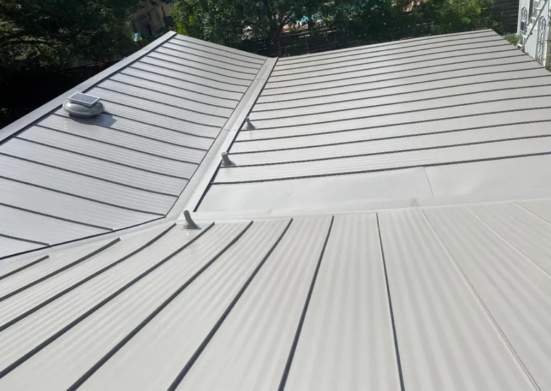 Solar attic fan installed on a metal roof for Roof Ventilation in Great Falls